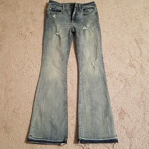 Destroyed high-rise denim jeans